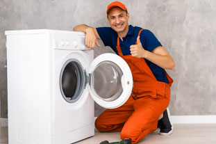 Washing Machine Repair Abu Dhabi. Expert Technicians Working Photo