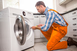 Washing Machine Repair Abu Dhabi. Expert Technicians Working Photo